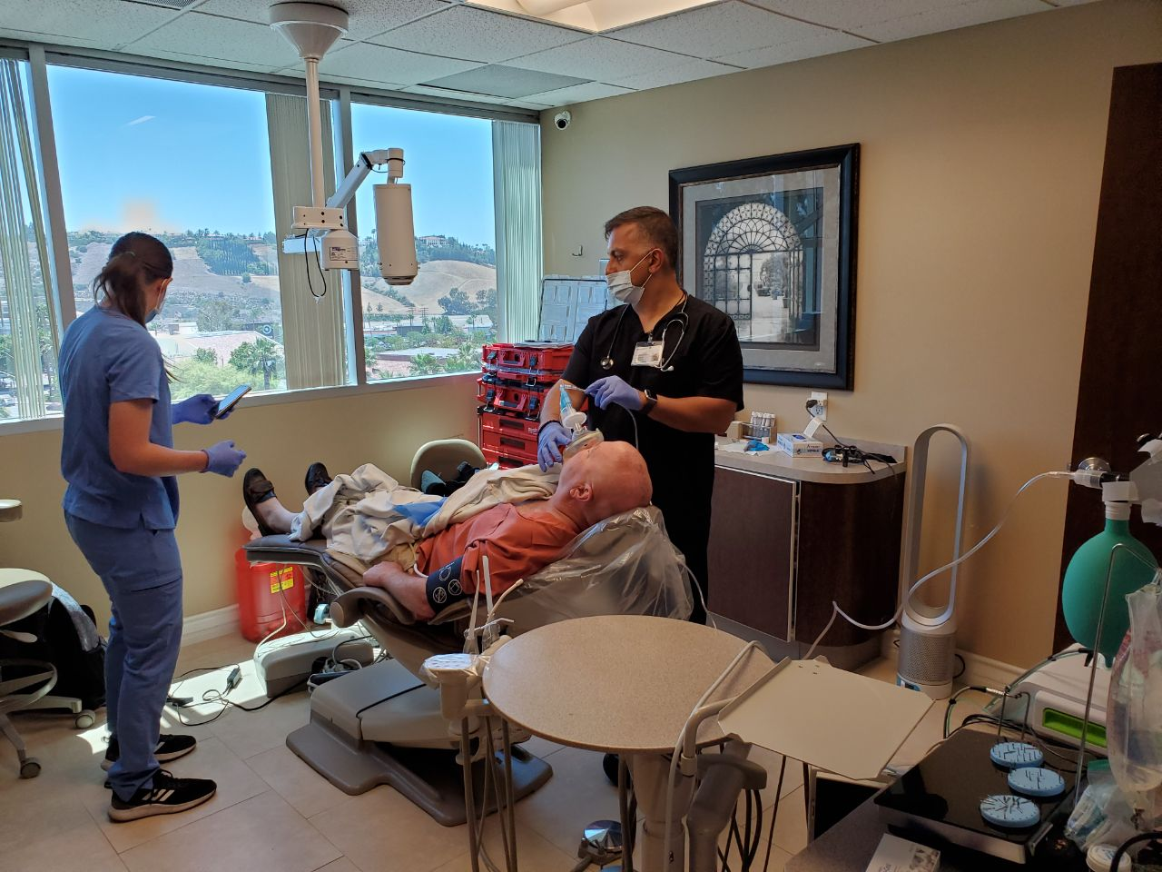 An experienced dentist providing extensive dental treatment to a patient