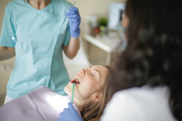 An experienced implant dentist examining a patient