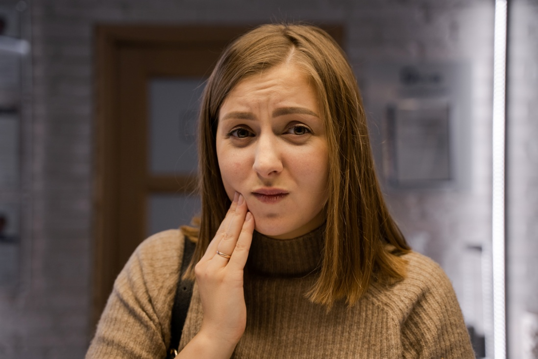 Woman experiencing tooth discomfort