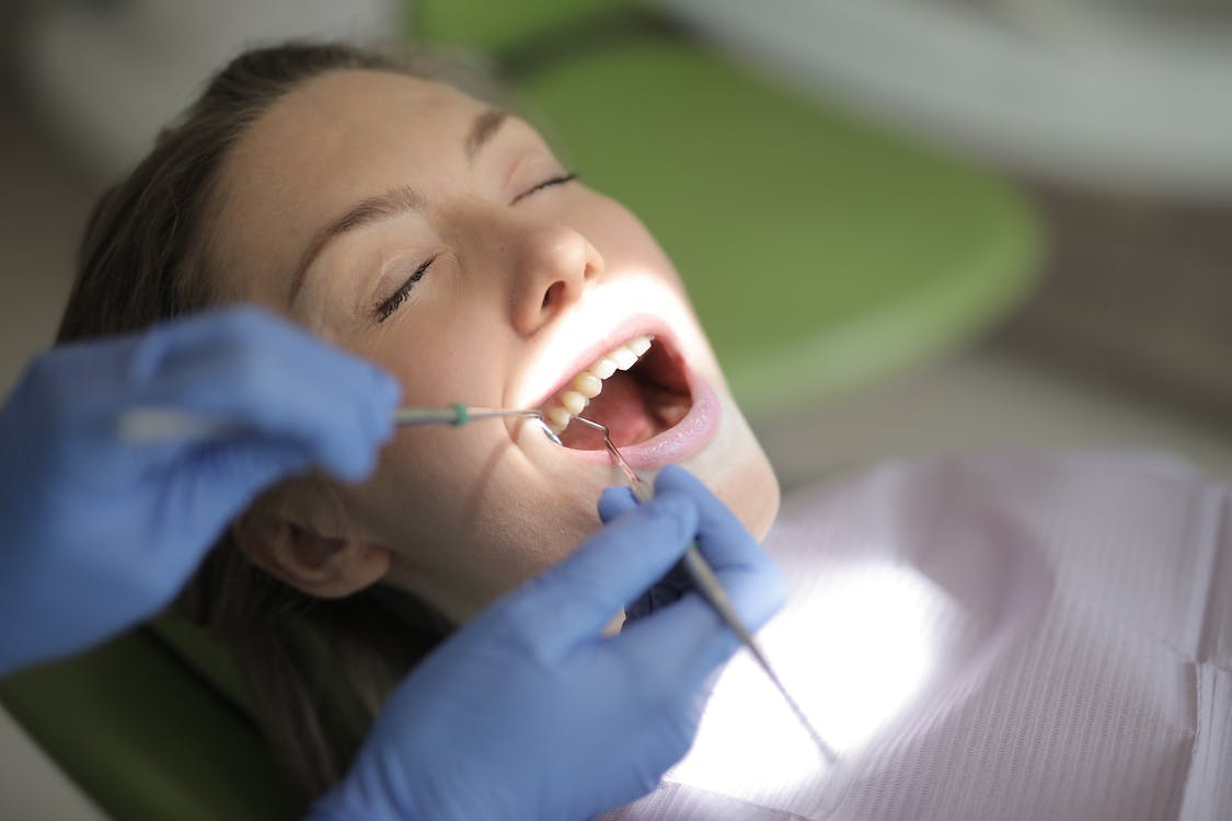 A person getting their teeth examined