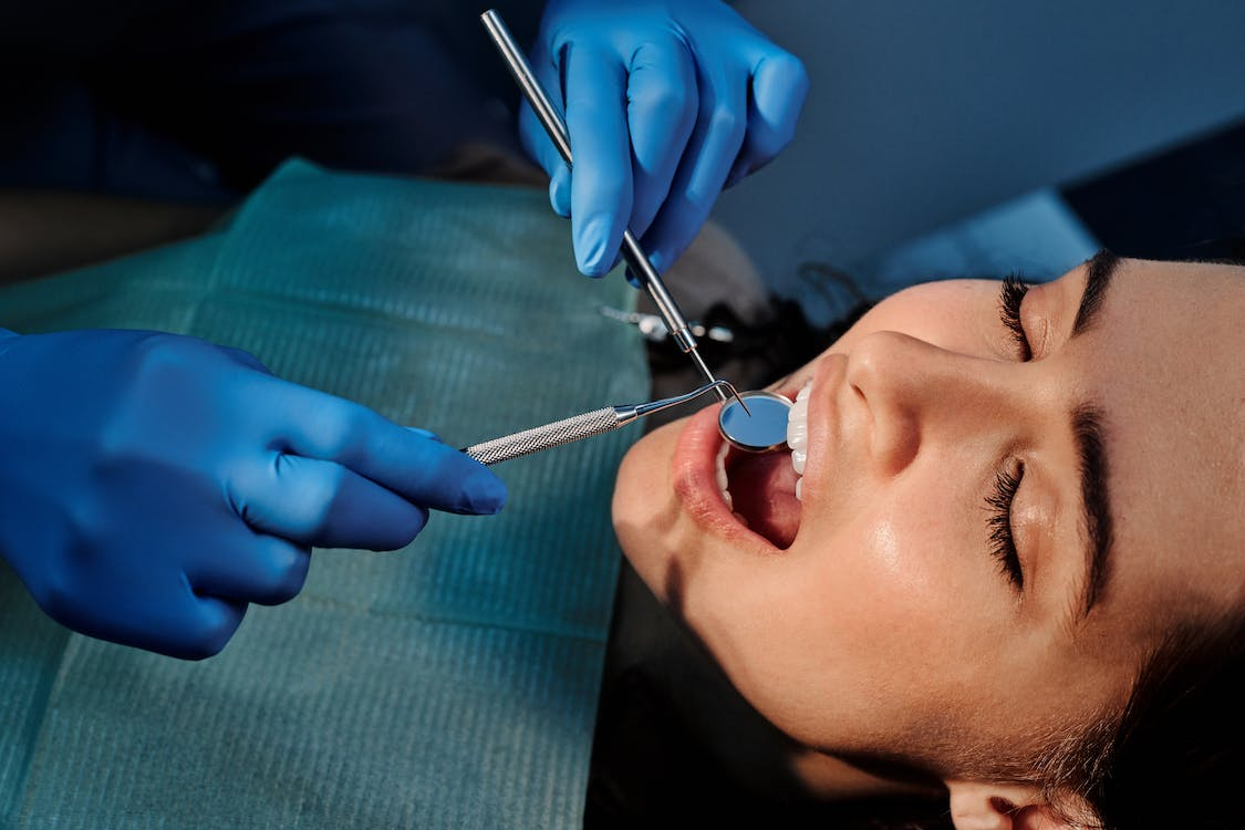 A person getting their teeth examined