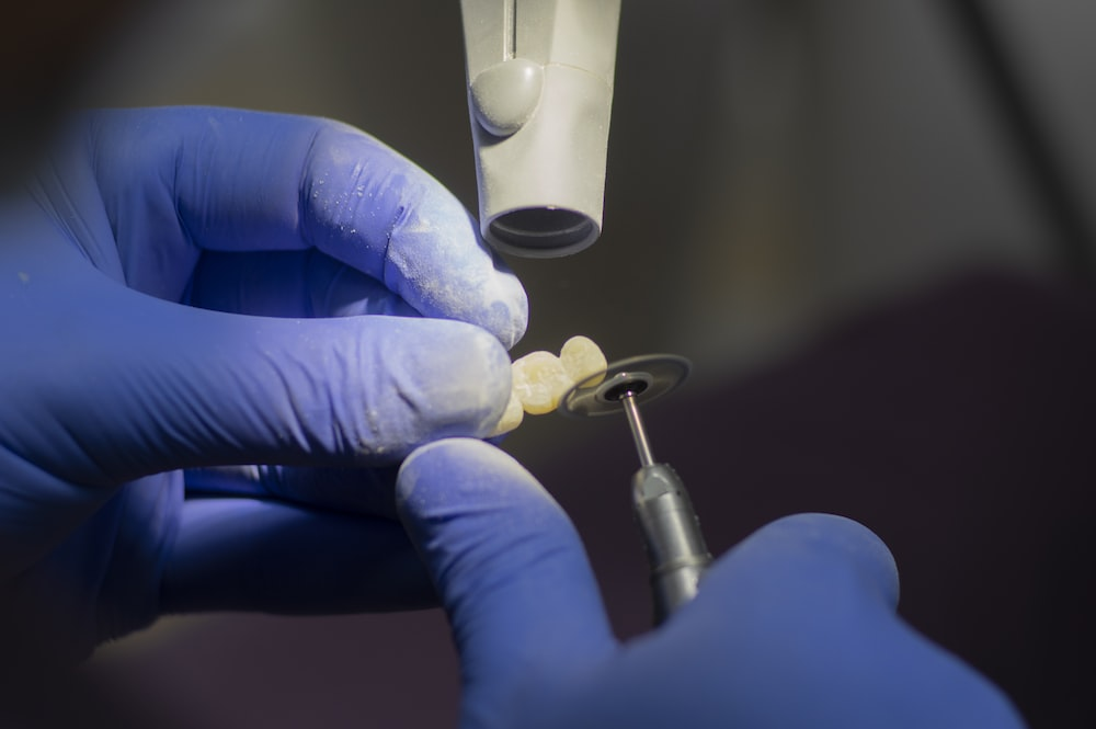 Dentist holding a denture