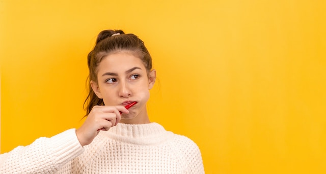 A girl brushing her teeth