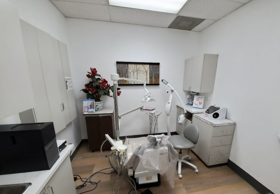 A dentist doing a procedure on a patient