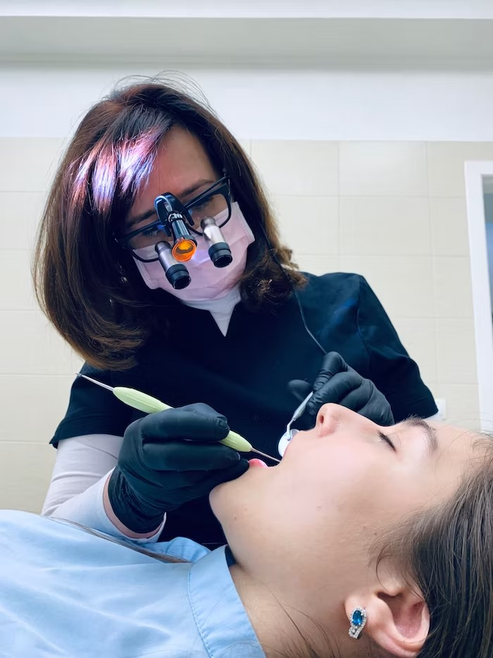 A dentist doing a procedure on a patient
