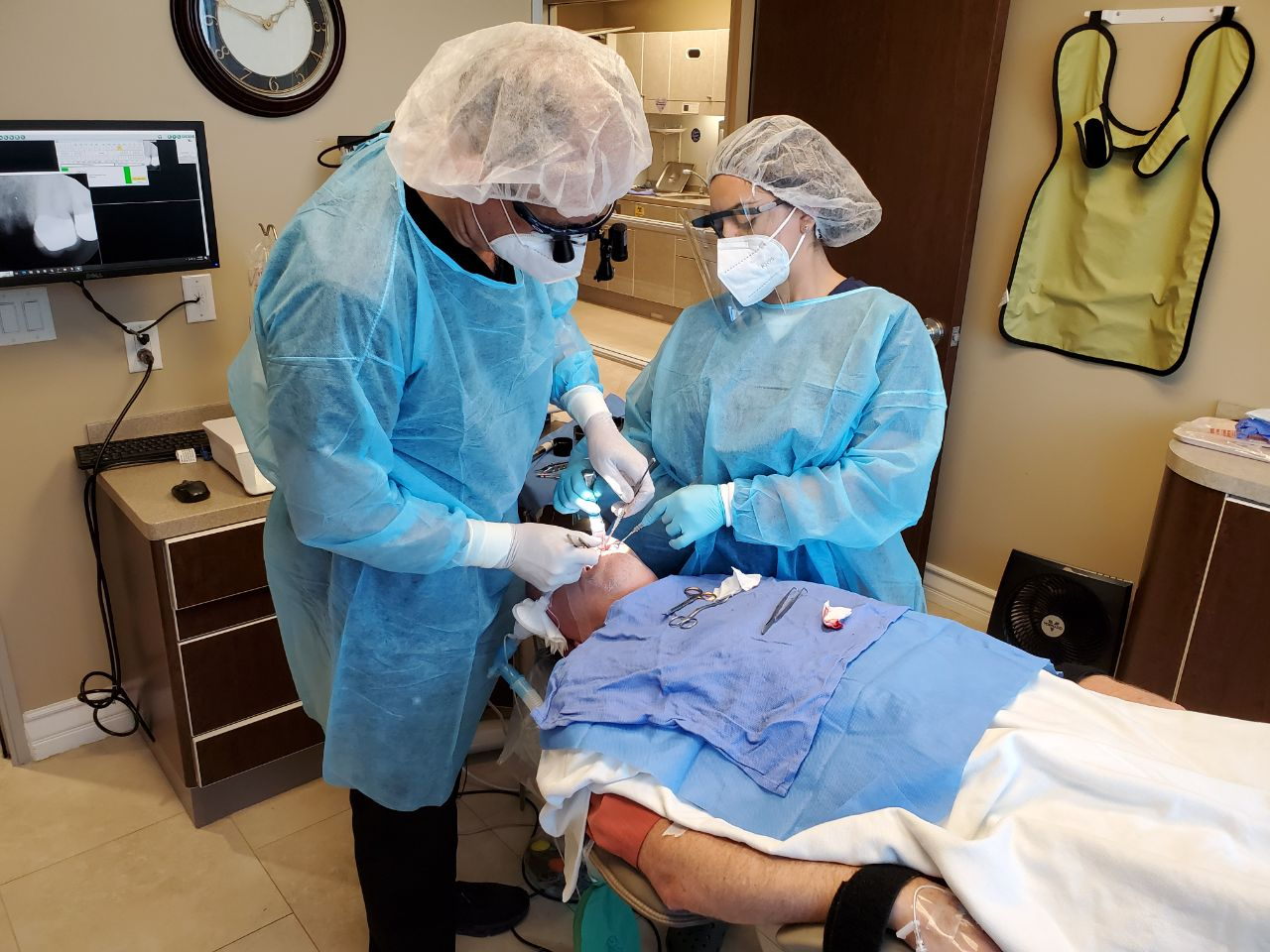 An oral surgeon conducting a dental surgery in Mission Viejo