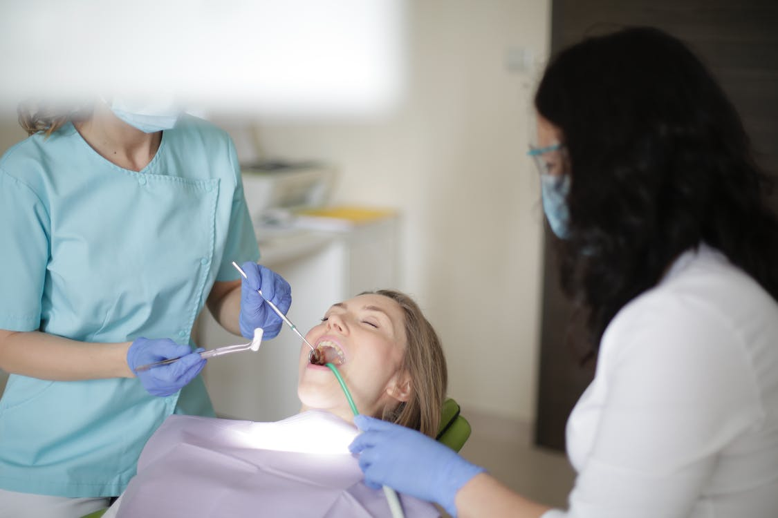 Person undergoing treatment at dental clinic