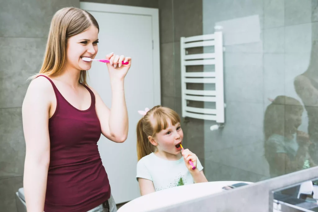using a Waterpik flosser or oral irrigator